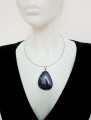 Wisiorek z lapis lazuli z posrebrzaną zawieszką. 
Rozmiar kamienia 51 mm x 39 mm